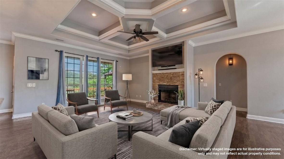 Image 4: Spacious living area featuring a tray ceiling with