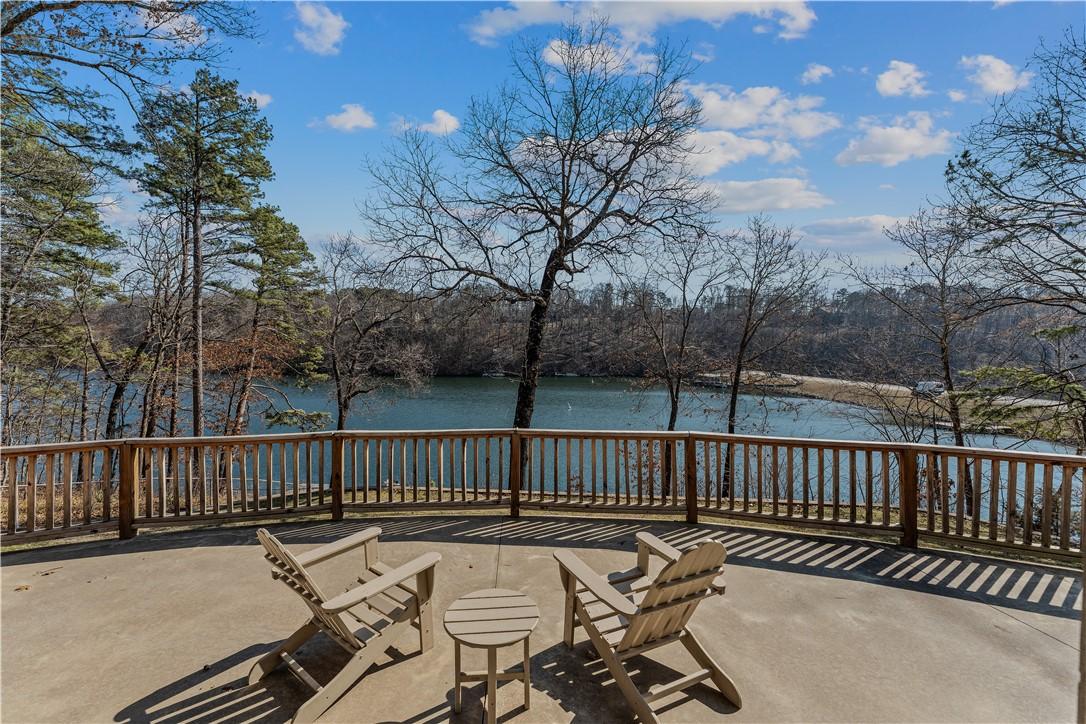 Image 3: View of lower patio / terrace with a water view.