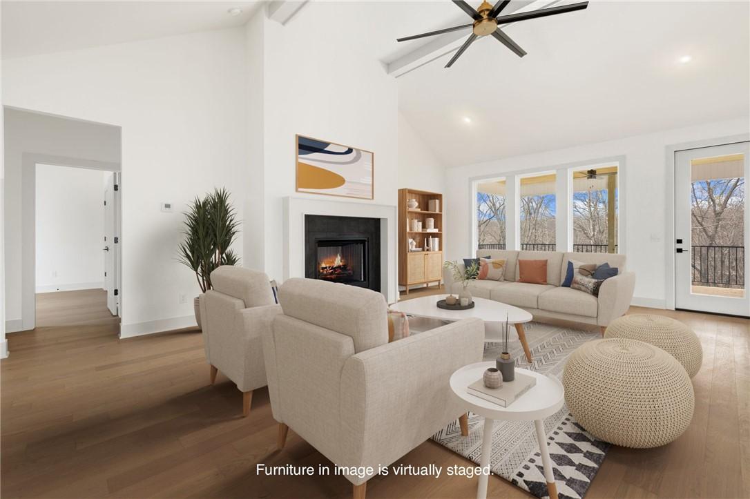 Image 4: Living room featuring wood finished floors, plenty
