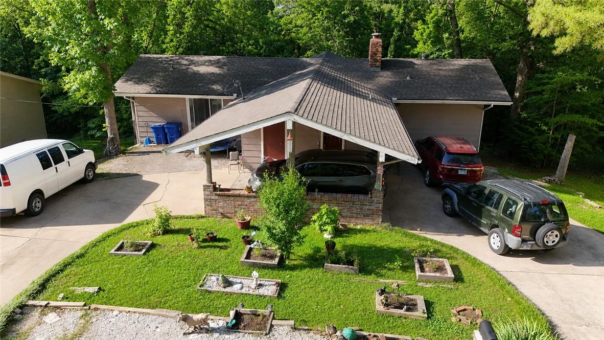 Image 4: Single-story residence featuring a covered carport