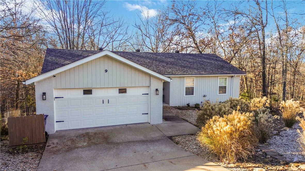 Image 1: Garage with concrete driveway