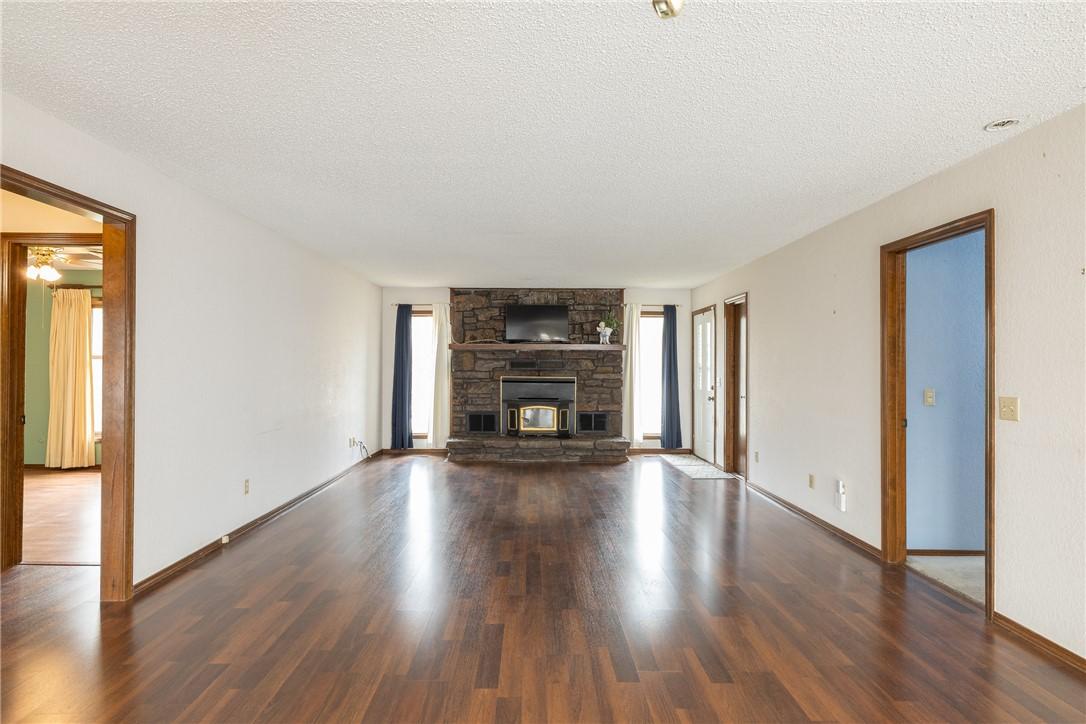 Image 4: Unfurnished living room featuring a textured ceili