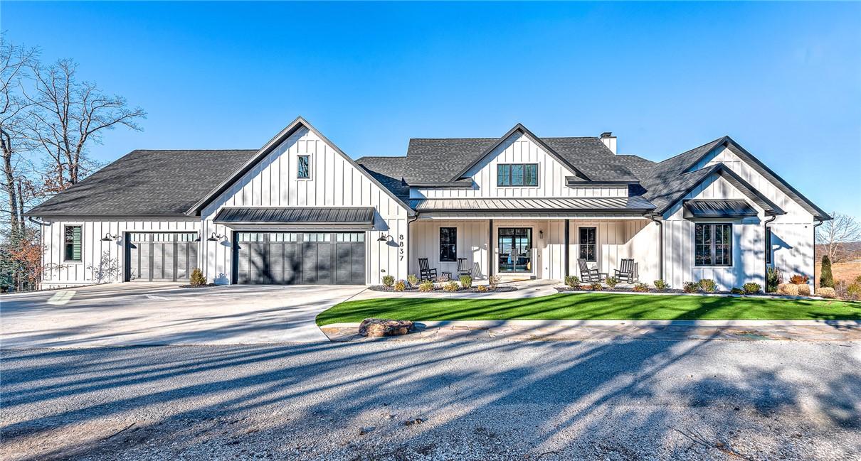 Image 2: Modern farmhouse style home featuring a standing s