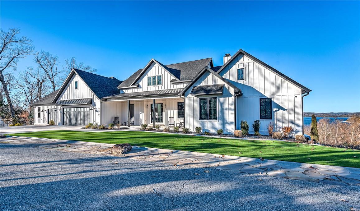 Image 3: View of front of house featuring board and batten