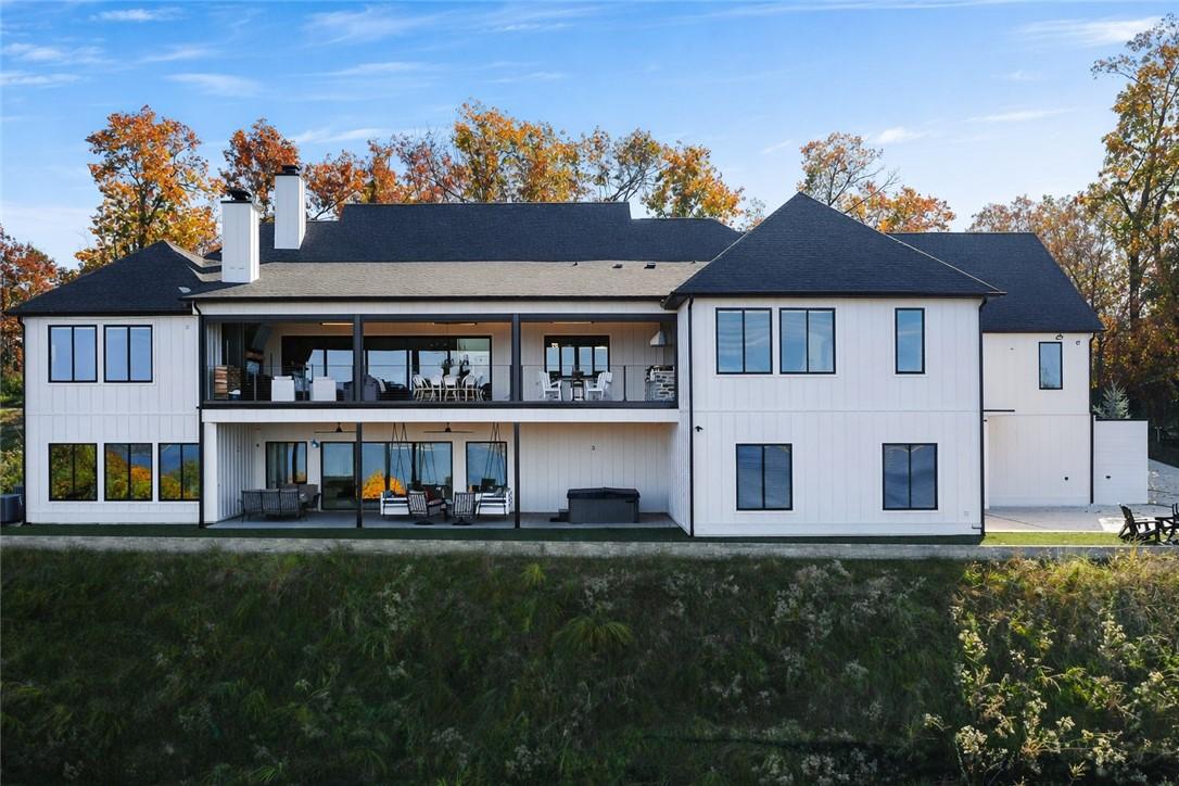 Image 4: Rear view of property featuring a patio area, a ch