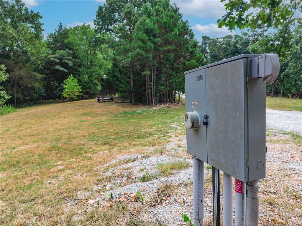 Image 3: Electrical service box with meter, conduit, and gr