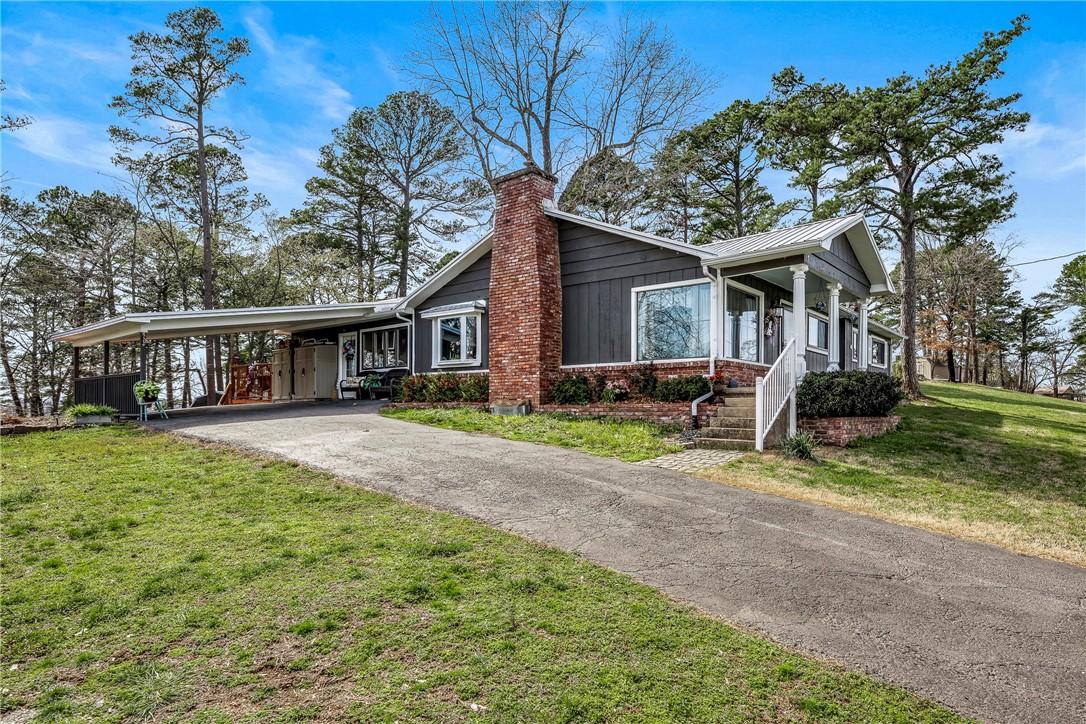 Image 2: View of front of property with a front lawn, aspha