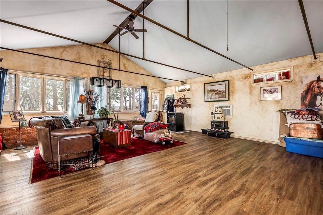 Image 4: Living area featuring wood finished floors and cei