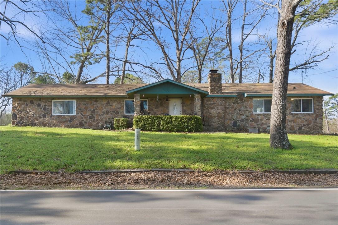 Image 3: Ranch-style house featuring a front yard, stone si