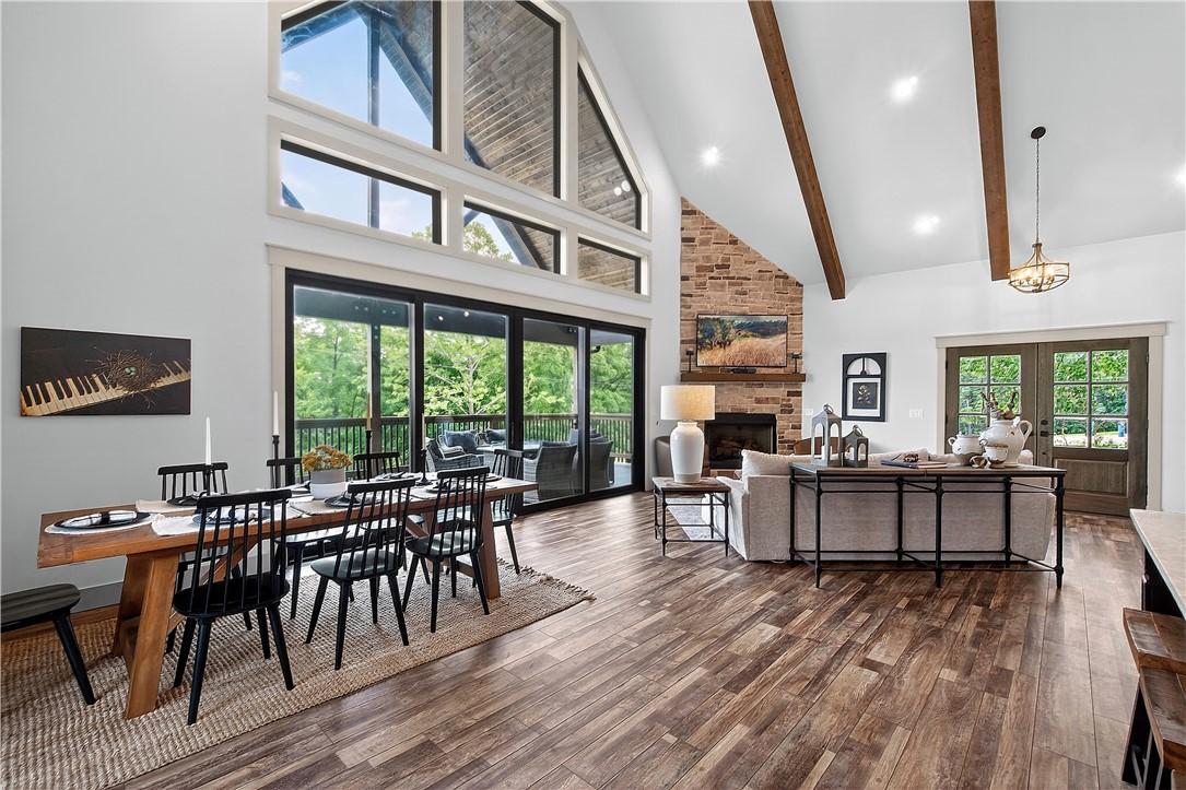 Image 2: Soaring ceilings in the main living area are accen