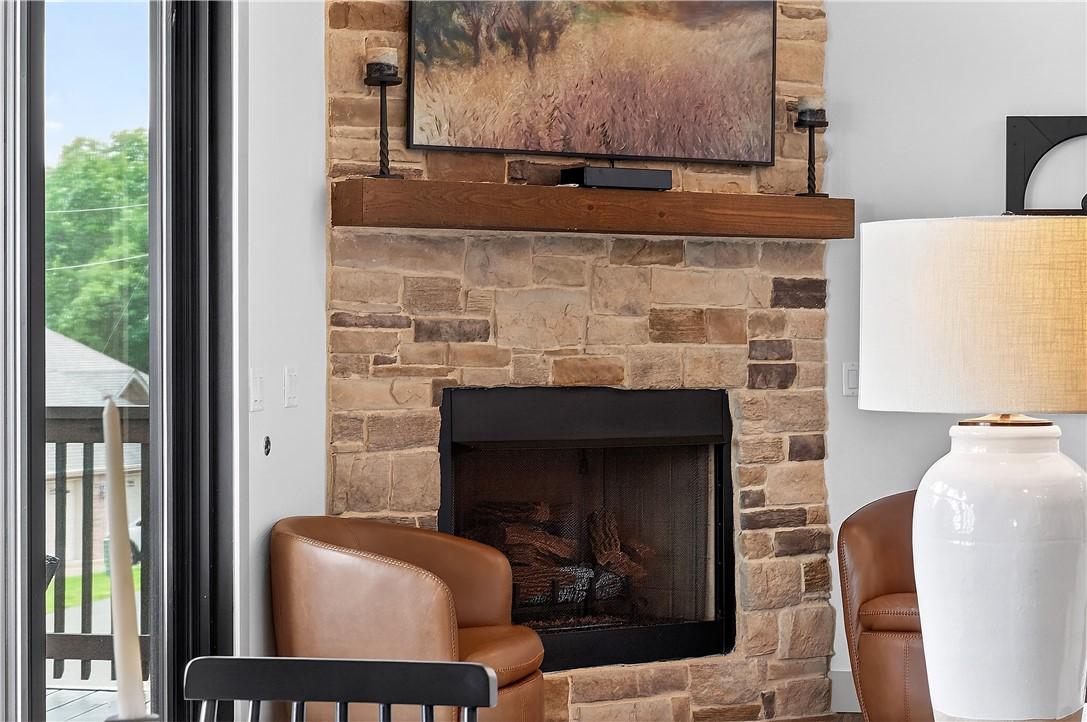 Image 4: Cozy stone fireplace in the living room.