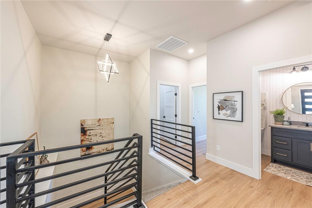 Image 3: Custom metal railing throughout.