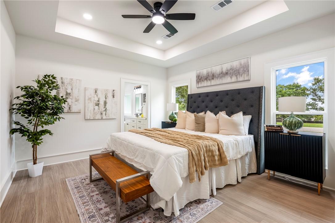 Image 3: Spacious room featuring tall windows and 8" basebo