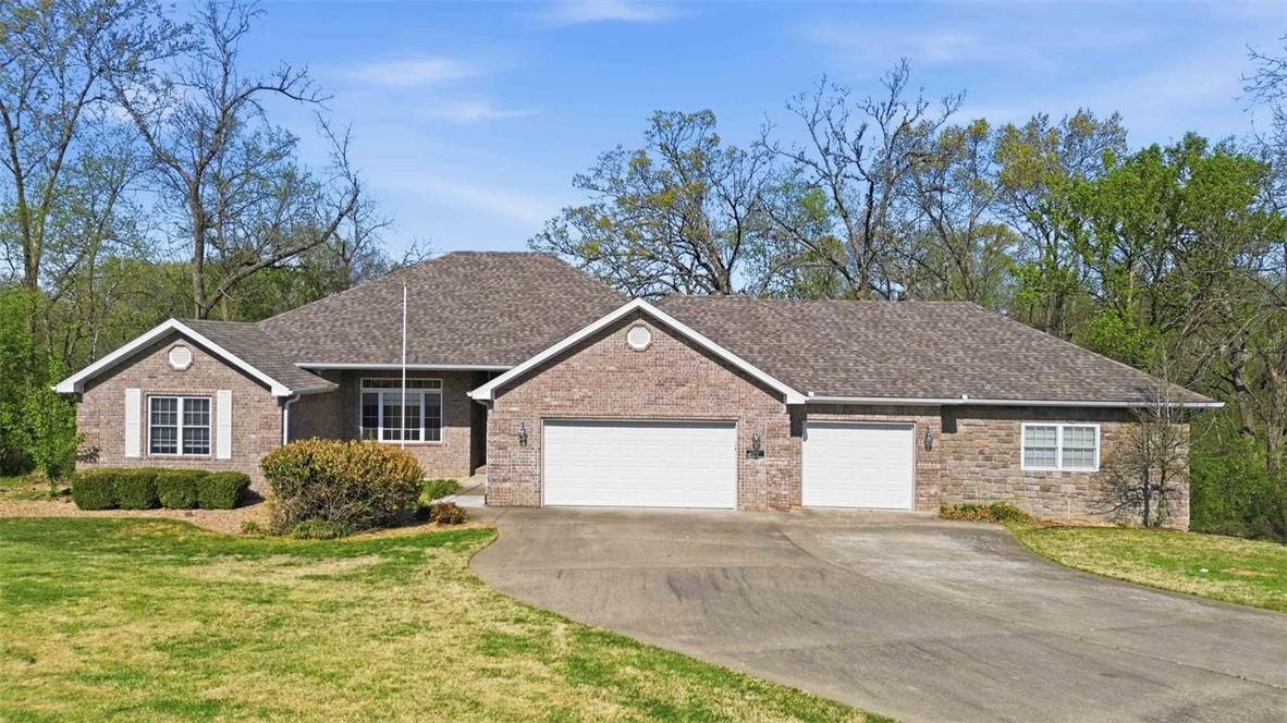 Image 4: Ranch-style house with an attached garage, concret