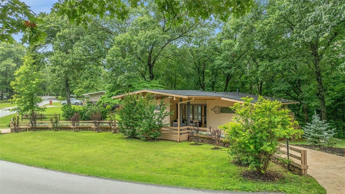 Image 2: Mid-century modern residence featuring a light-col