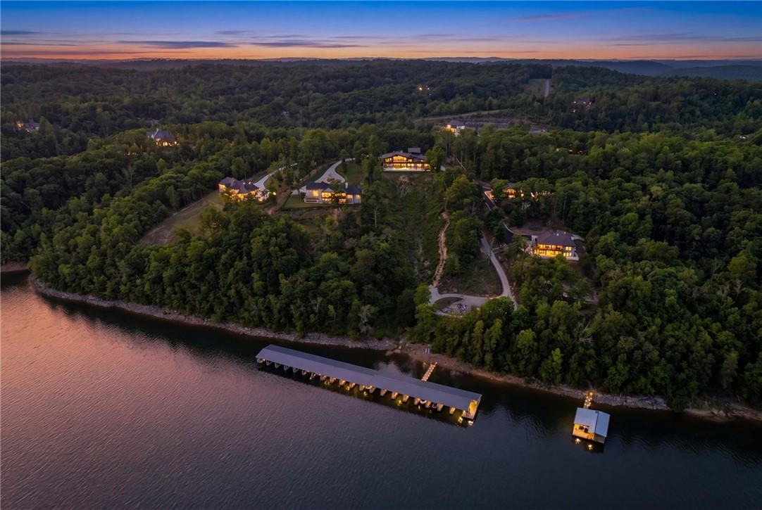 Image 2: Lakefront property featuring a private boat dock,