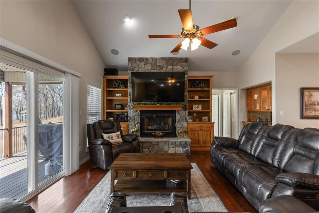 Image 3: Living room with lofted ceiling, hardwood / wood-s