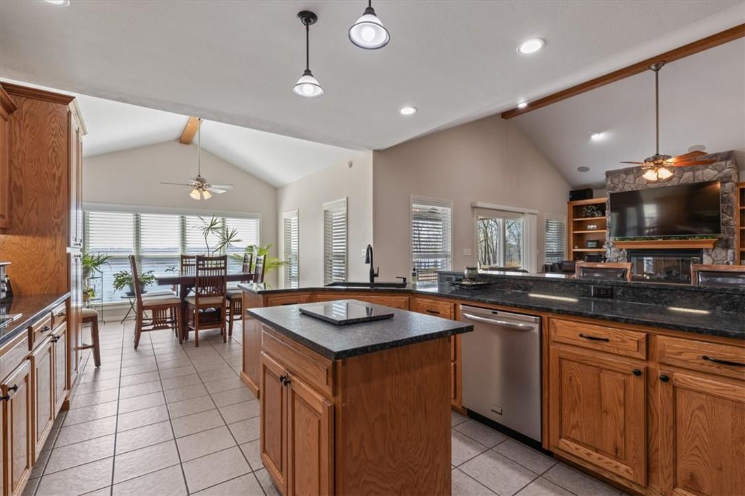 Image 4: Kitchen featuring a ceiling fan, open floor plan,