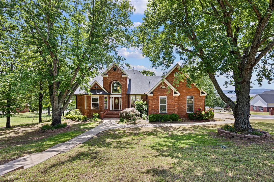 Image 4: Traditional brick residence featuring a prominent