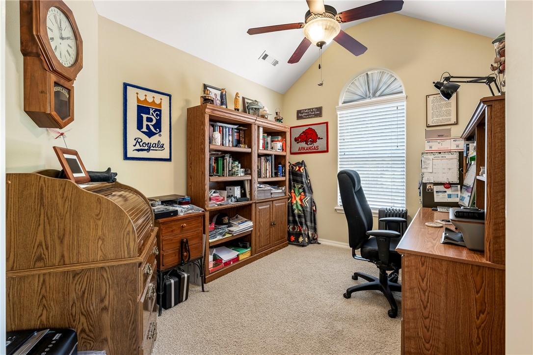 Image 4: Carpeted room featuring a vaulted ceiling and an a