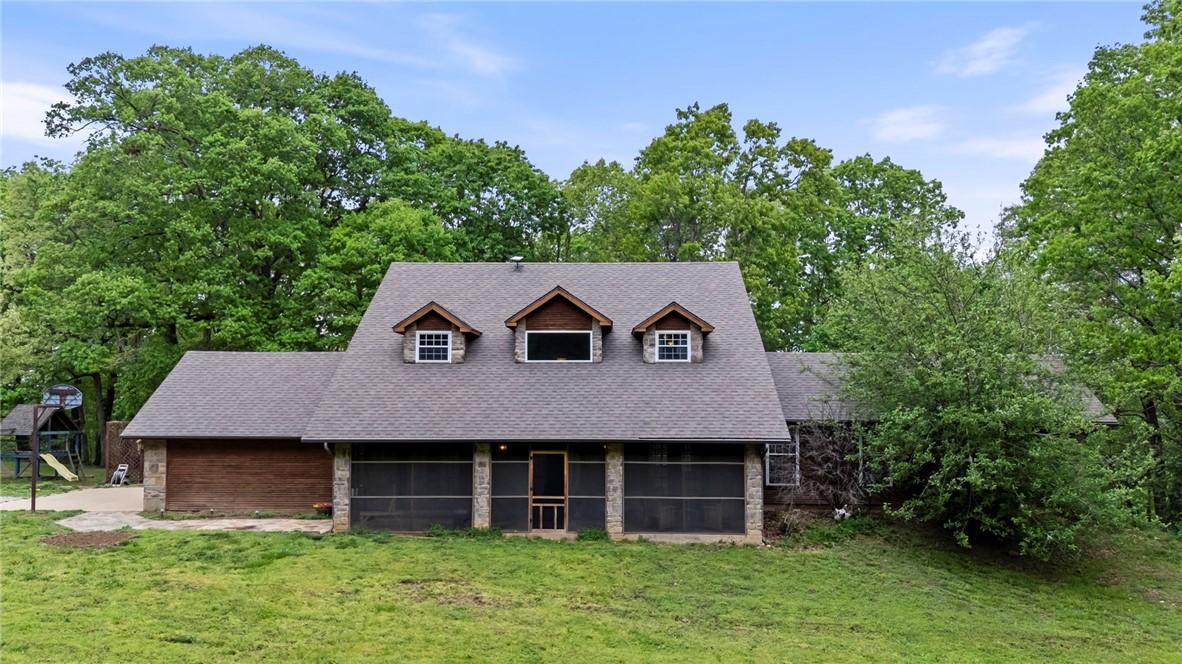 Image 2: Cottage-style residence featuring a screened porch