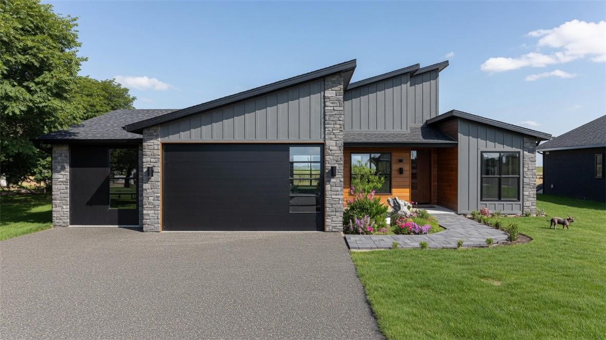 Image 2: Modern farmhouse residence showcasing a striking b