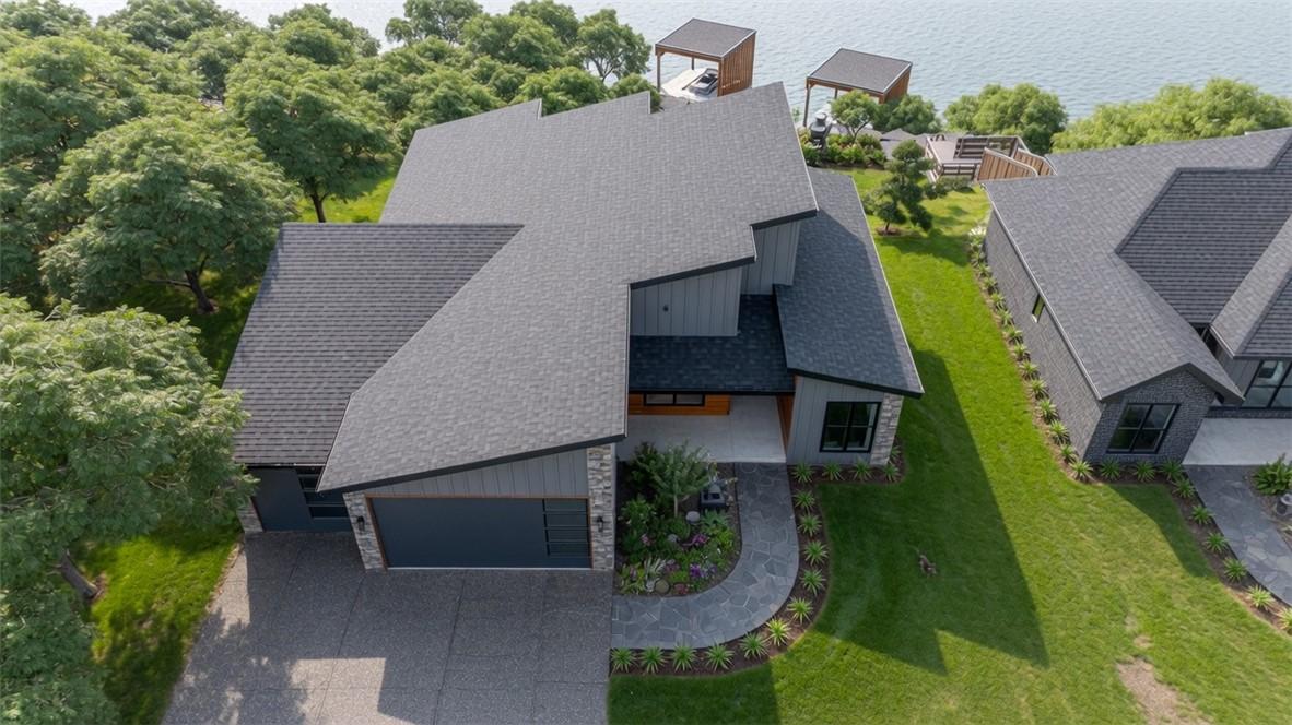 Image 4: Modern architectural home featuring a striking cha