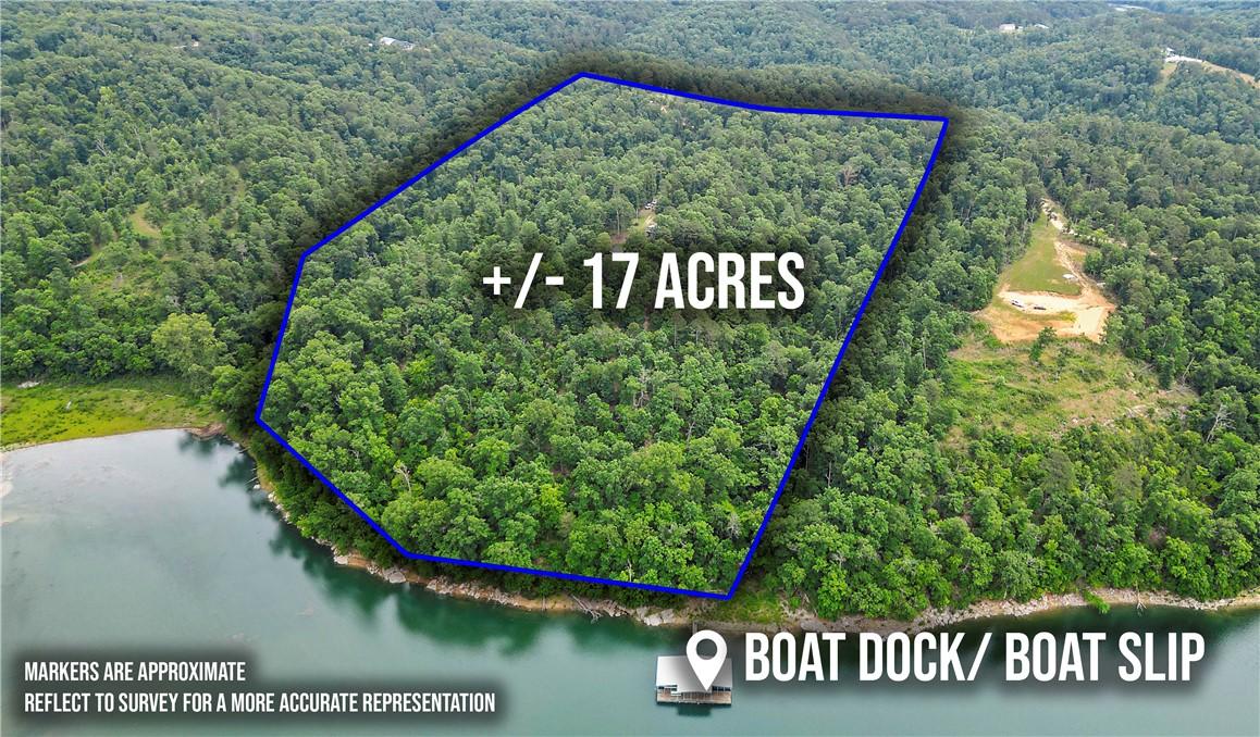 Image 2: Wooded acreage with significant waterfront access