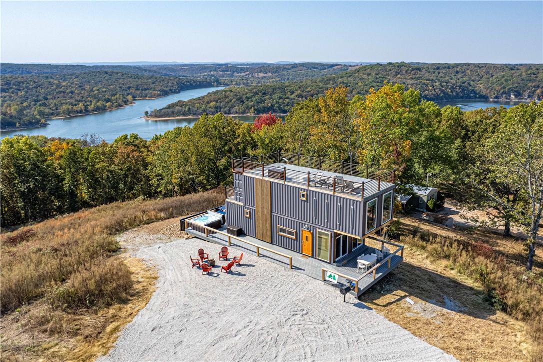 Image 3: Multi-level container home featuring an upper-leve