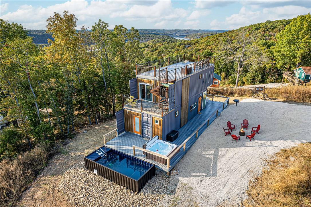 Image 4: Multi-level container home featuring an exterior s