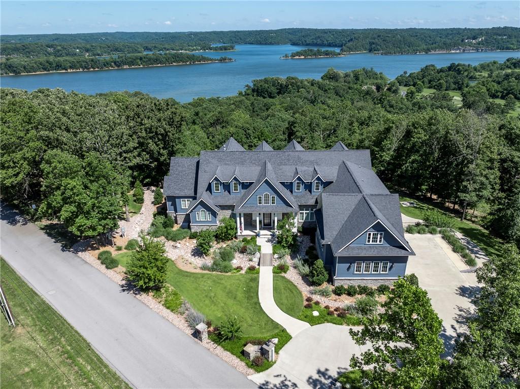 Image 2: Drone view of home and Beaver Lake proximity