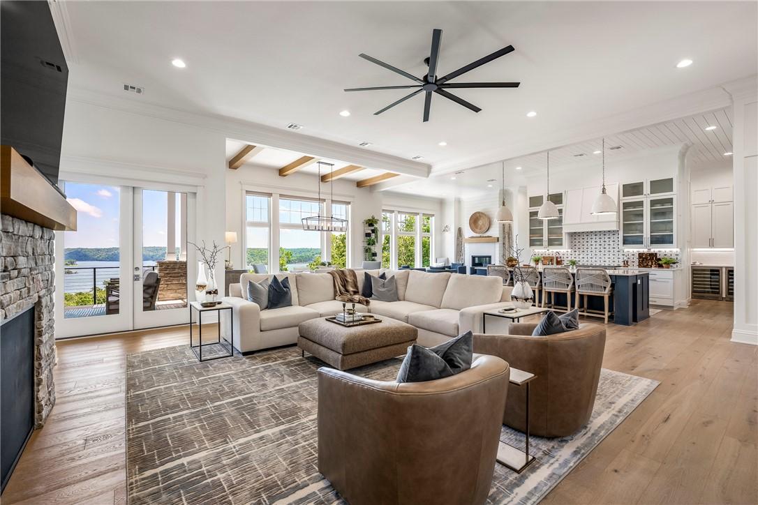 Image 4: Great Room into Kitchen, Dining, and Hearth Living