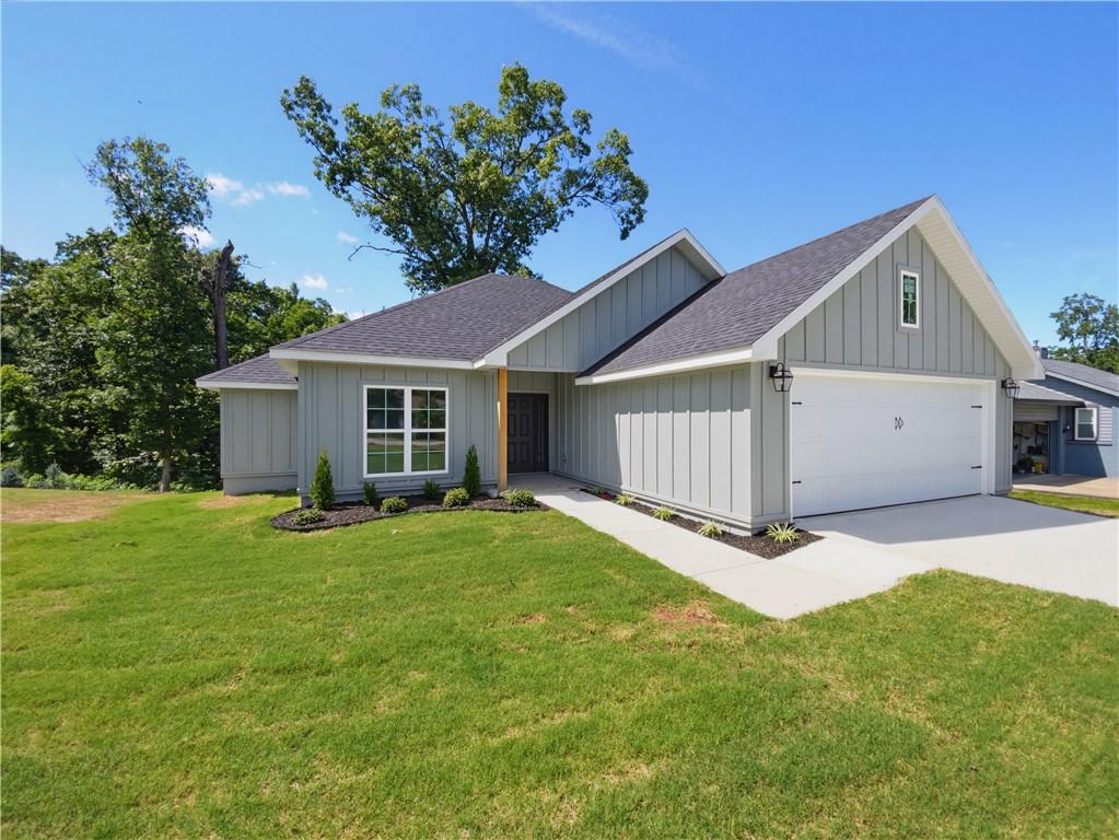 Image 3: Modern farmhouse-style exterior featuring light gr