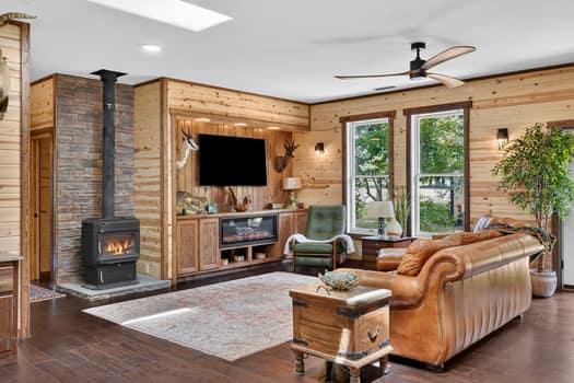 Image 4: Spacious living area featuring wood-finish floorin