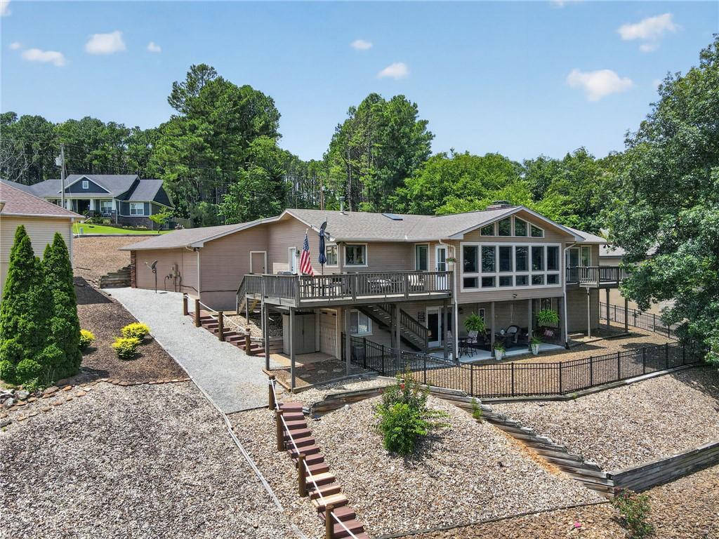 Image 3: Multi-level property with expansive decking and a