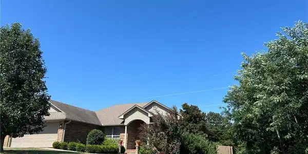 Image 4: Traditional-style residence featuring a brick faca
