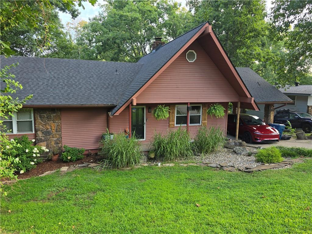 Image 1: Front exterior featuring a prominent gable with ho