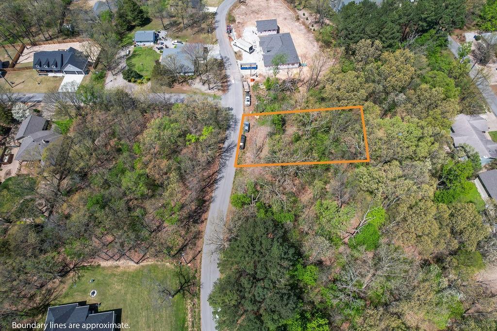 Image 2: Wooded residential lot featuring mature trees and