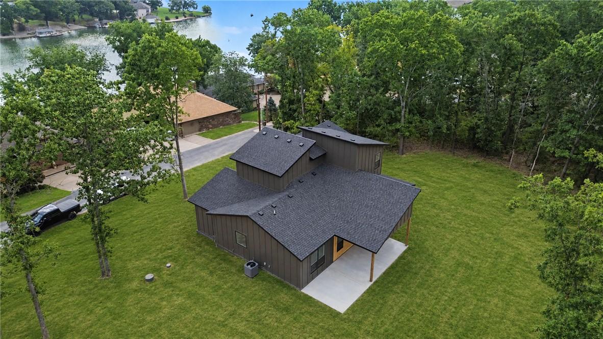 Image 3: Expansive green lawn surrounding the property