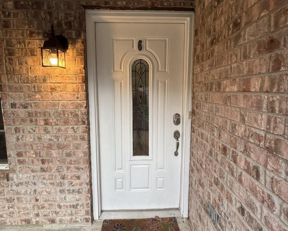 Image 3: Entrance to property with brick siding