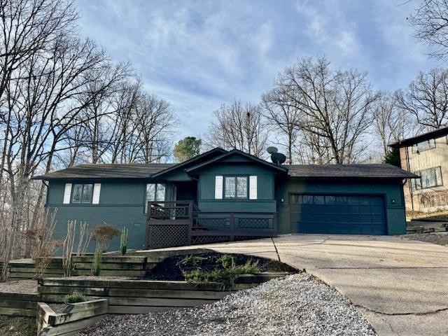 Image 2: Ranch-style house featuring driveway, a garage, an
