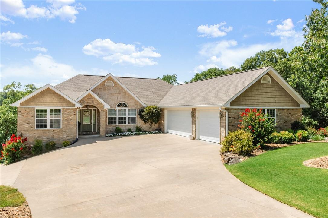 Image 4: front of home, driveway has a gentle slope