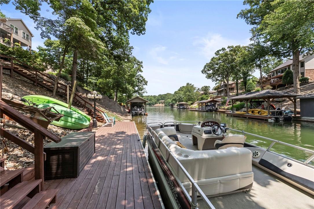 Image 3: Dock featuring a water view