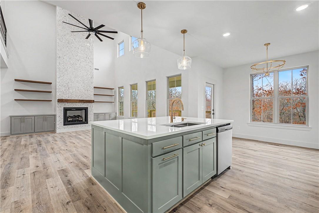 Image 3: Open-concept kitchen and living area.