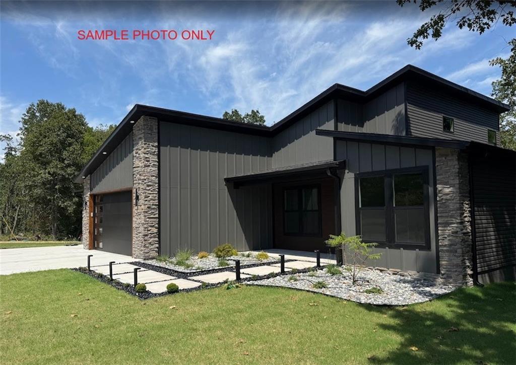 Image 3: Contemporary exterior featuring a combination of v