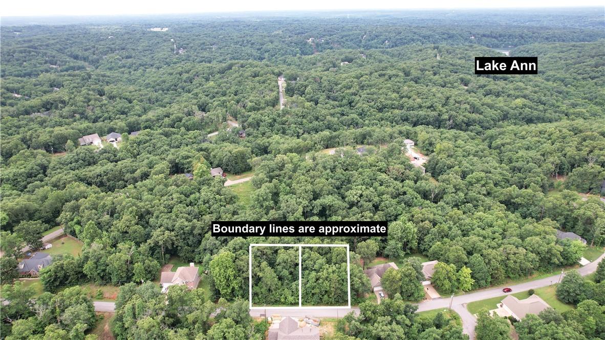 Image 2: Wooded lot with established trees and surrounding