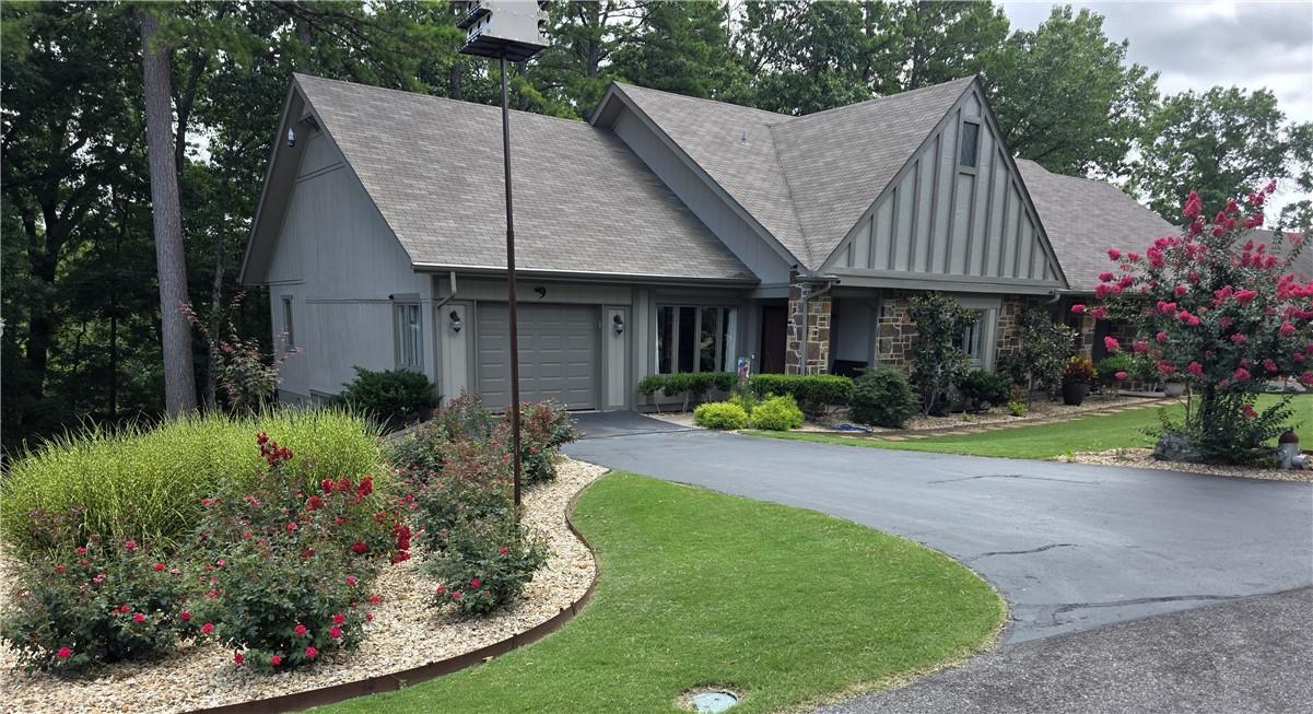 Image 3: Gabled roofline residence featuring stone and sidi