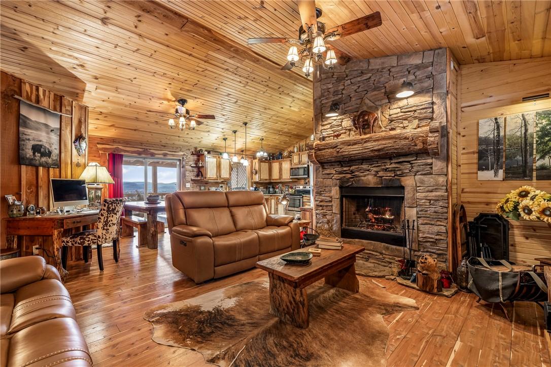 Image 4: Living room with wooden walls, light wood finished