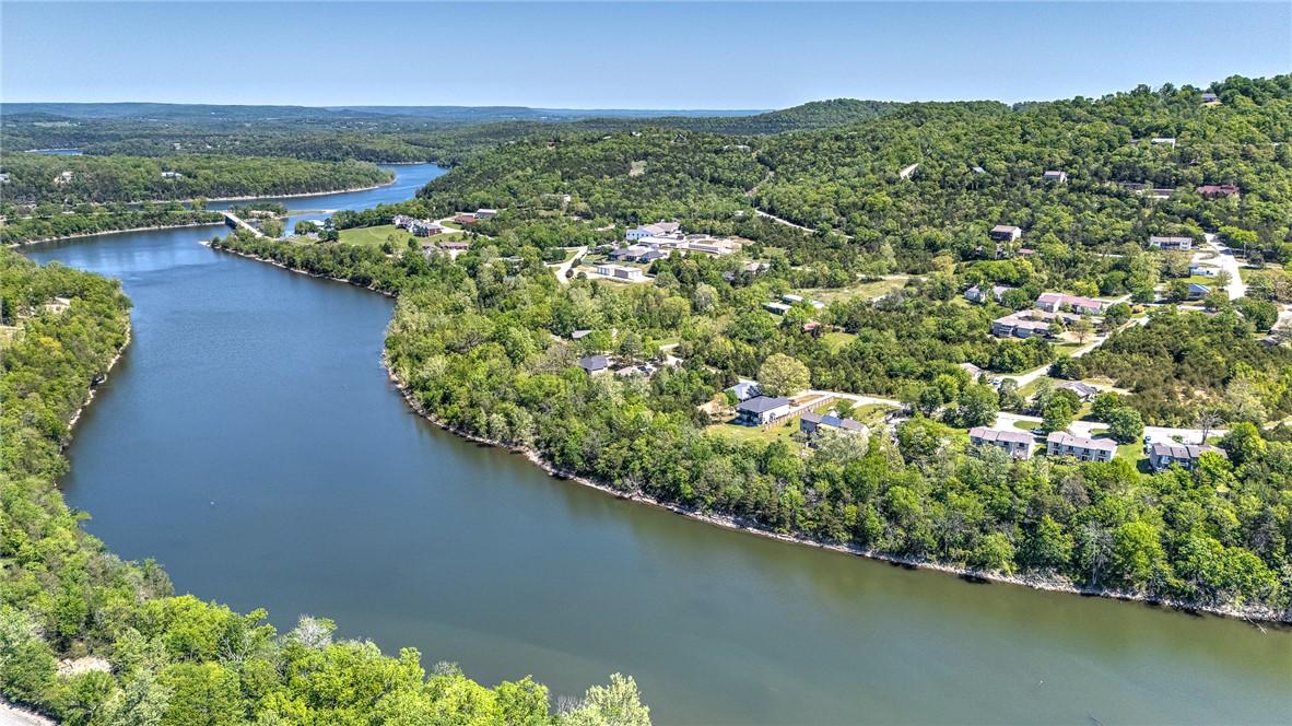 Image 1: Expansive waterfront properties nestled among lush
