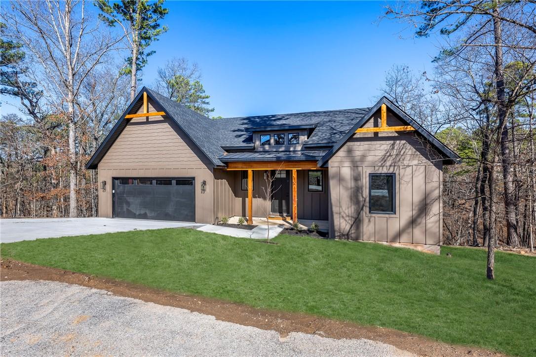 Image 2: Transitional home with board and batten siding, a